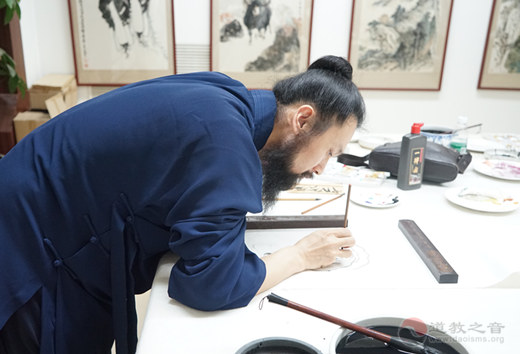 中国道教协会道家书画院举行“爱党爱国爱社会主义”书画笔会